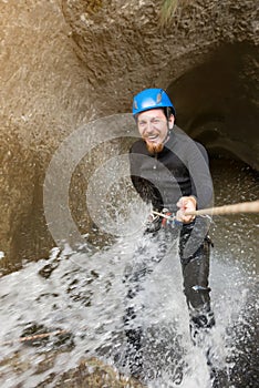 Canyoning in waterfall