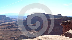 Canyonland desert area with sun rising in background