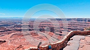 CANYONLAND, UT - JUNE 2018: Two girls enjoy the beautiful canyon scenario