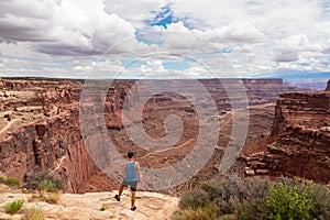 Canyonlands - Man with scenic view from Shafer Trail Viewpoint in Canyonlands National Park near Moab, Utah, USA