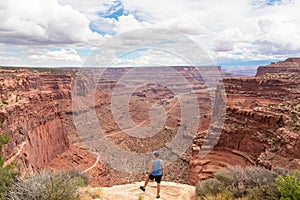 Canyonlands - Man with scenic view from Shafer Trail Viewpoint in Canyonlands National Park near Moab, Utah, USA