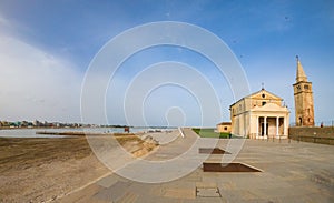 Caorle sea and Madonna dell`Angelo church at sunset and blu sky