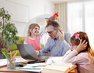 Caos- Father And SchoolGirl Working At Home photo