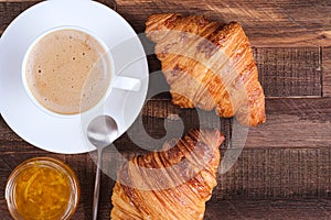 Cap coffee cappuccino and two croissant with jam