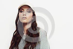 Cap, fashion and woman portrait in studio with attitude, confidence and casual style on white background. Trendy, face
