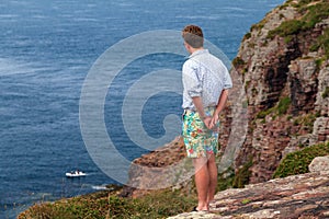 Cap FrÃ©hel tourist looking at the ocean