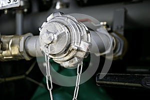 Cap mounted on a nozzle intended to collect a frother from an outside tank capacity of a fire fighting vehicle