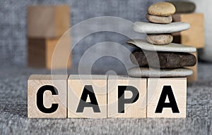 CAPA word made with building blocks, business concept photo