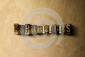 CAPABILITIES - close-up of grungy vintage typeset word on metal backdrop