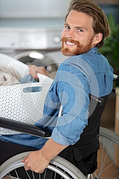 capable disabled man doing laundry