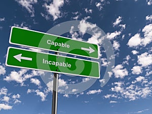 Capable - Incapable traffic sign on blue sky