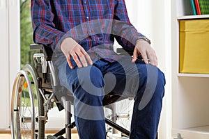 Capable man in shirt on wheelchair photo