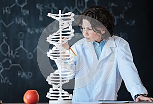 Capable young researcher exploring genomics in the laboratory photo