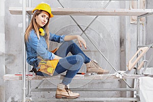 Capable young woman construction worker photo