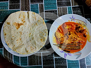 Capati bread served with fish head curry sauce
