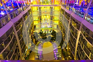 Cape Canaveral, USA - May 06, 2018: Open deck in the night time. Giant cruise ship Oasis of the Seas by Royal Caribbean.