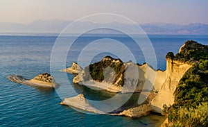 Cape Drastis at sunset close to Peroulades and Sidari village - Beautiful coast scenery with High cliffs and paradise beach -