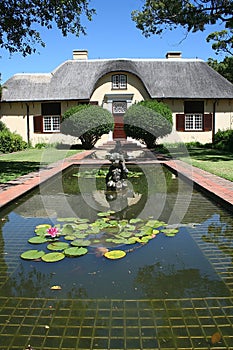 Cape Dutch house behind reflecting pond