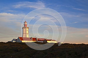 Cape Espichel lighthouse on sunset light