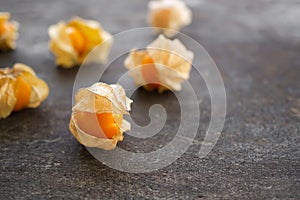 Cape gooseberry or physalis minima on wood background.