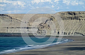 Cape with gray cliffs in the ocean