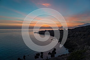 Cape Greco against sunrise scene