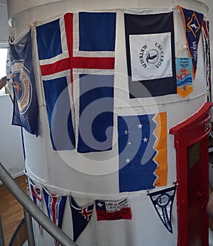 Flags at the famous lighthouse at Cape Horn, Chile. Cape Horn is the southernmost headland of the Tierra del Fuego archipelago