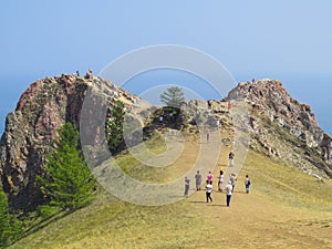 Cape of love. Olkhon Island. Tourists go on a tour