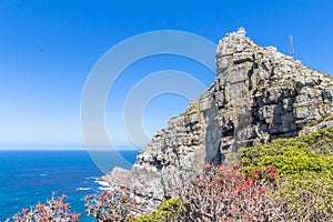 Cape Point with the old lighthouse built in 1850 high up on the cliff overlooking the Atlantic ocean near Cape Town