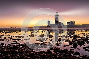 The Cape Recife lighthouse guiding ships pass the Thunderbolt reef on the coastline of Port Elizabeth, South Africa