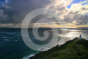 Tropical storm ocean cyclone clouds above the Pacific Ocean, dramatic seascape with Cape Reinga Lighthouse landmark in New Zealand