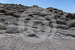 Cape Stolbchaty. Cape on the west coast of the island of Kunashir. It is composed of layers of basaltic lavas of the Mendeleyev v