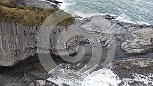 Cape Stolbchaty on the island of Kunashir, Kuril Islands, a unique geological volcanic formation included in UNESCO list. Aerial v