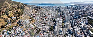 Panoramic aerial view of Cape City Centre with a mix of old and modern buildings, skyscraper and the Table Bay Harbour background photo