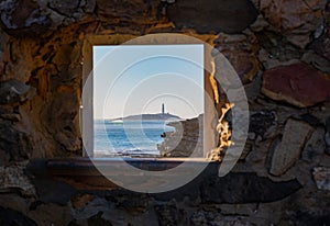 Cape of trafalgar seen from a window in CaÃ±os de Meca photo