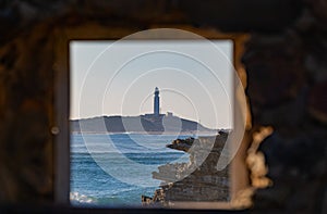 Cape of trafalgar seen from a window in CaÃ±os de Meca photo