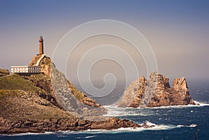 Cape Vilan lighthouse and VilÃ¡n de FÃ³ra islet, CamariÃ±as, Galicia, Spain photo