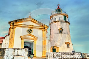 Capela de Nossa Senhora da Guia and Guia Lighthouse at the Guia Fortress in Macau, China photo