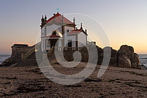 Capela do Senhor da Pedra or Lord of the rock chapel illuminated at night, Miramar,