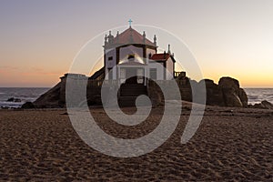 Capela do Senhor da Pedra or Lord of the rock chapel illuminated at night, Miramar,