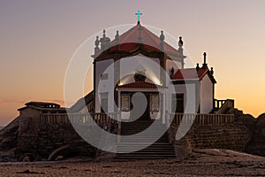 Capela do Senhor da Pedra or Lord of the rock chapel illuminated at night, Miramar,