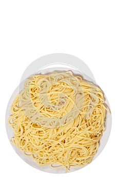 Capellini pasta on plate. top view. isolated