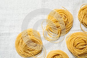Capellini pasta on white tablecloth