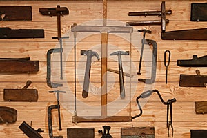 Ancient Carpenter Tools on a wooden wall