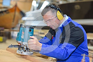 Capenter wood sanding at machine