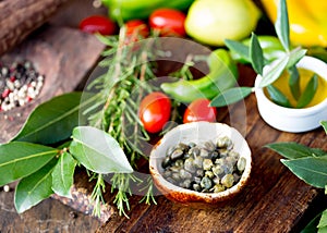 Capers and herbs. Selective focus
