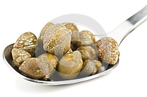 Capers in silver spoon