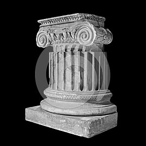 Capital of the ancient Greek Ionic order isolated over black background