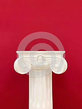 Capital of the ancient Greek Ionic order isolated over white background vintage