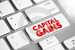 Capital gains - increase in a capital asset`s value and is realized when the asset is sold, text button on keyboard